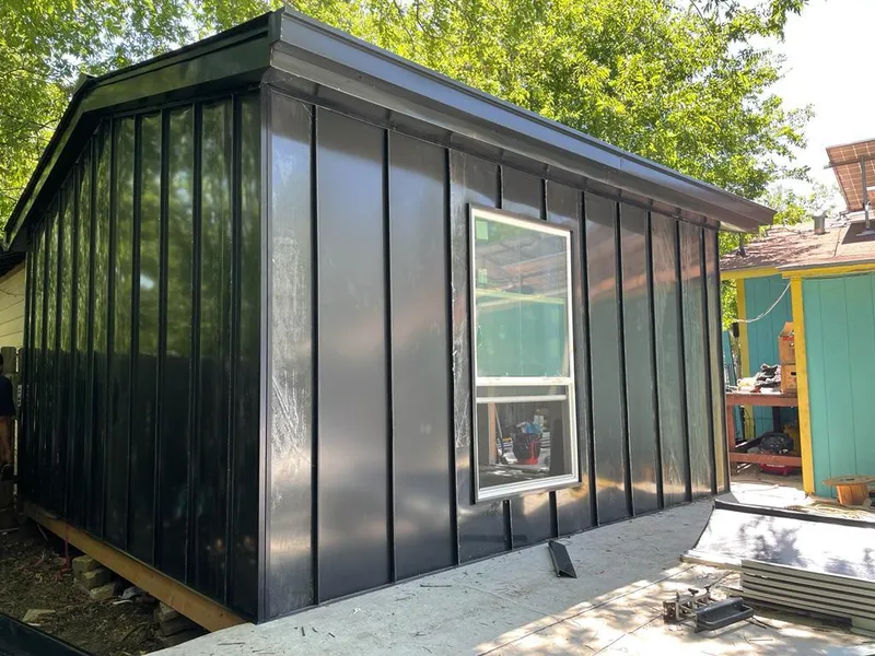 Black standing seam metal wall panels for Roof Inspection in Charlton