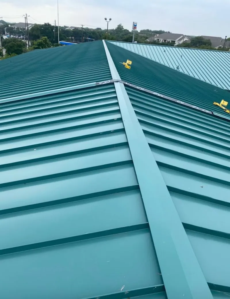 Green commercial metal roof ridge and valley for Metal Roof Repair in Charlton